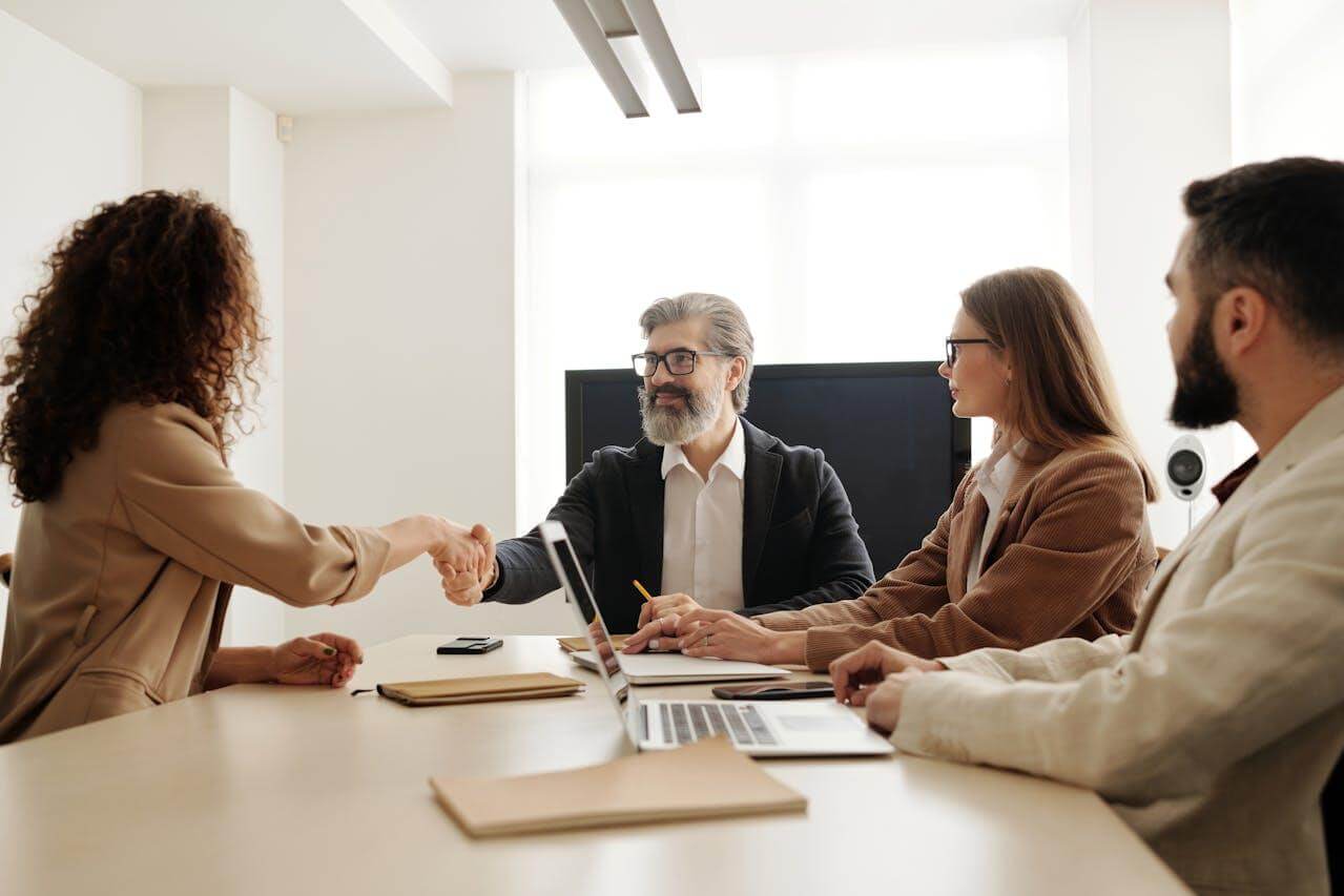 Colleagues shaking hands in the office