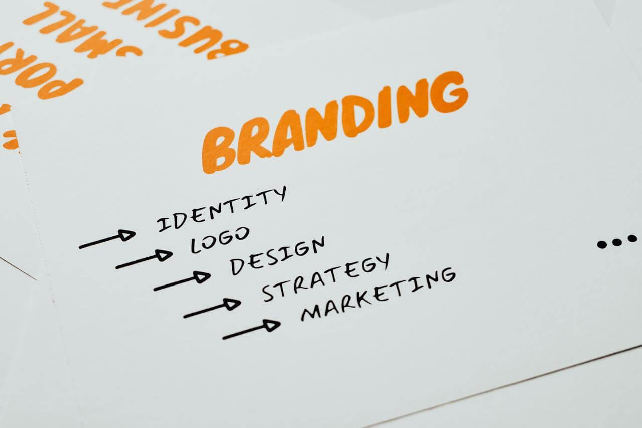 Orange and black text about branding on a white surface